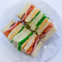 Island Club · Triple decker on your favorite toasted bread with turkey, ham, bacon, mayo, lettuce, tomato,...