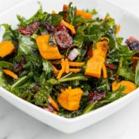 Side Kale Salad · Massaged kale, roasted sweet potato, shredded carrot, red onion, cranberries and lemon.