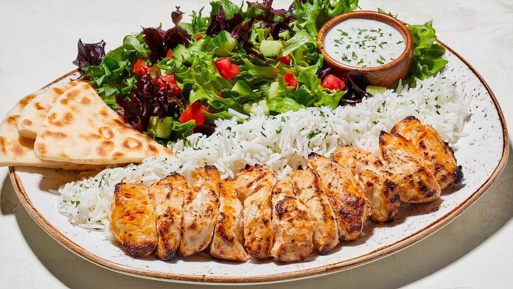 Flat Cut Chicken Kabob Plate · Thinly cut pieces of savory chicken.  Plates include: Basmati rice, pita bread, tzatziki, and choice of house salad (+85 Cals), Greek cabbage (+160 Cals), original hummus (+330 Cals), or spicy harissa hummus +$1 (+440 Cals)