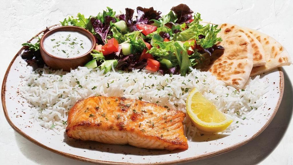 Grilled Salmon Plate · Kosher salmon filet simply seasoned and grilled. Plates include: Basmati rice, pita bread, tzatziki, and choice of house salad (+85 Cals), Greek cabbage (+160 Cals), original hummus (+330 Cals), or spicy harissa hummus +$1 (+440 Cals)