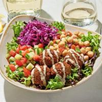 Luna Vida Vegan Bowl · Housemade falafel served on top of a bed of lettuce with lemon vinaigrette, Greek cabbage, c...