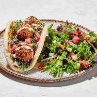 Falafel Pita · Greek cabbage, shredded kale, diced tomato, falafel and sauce wrapped in pita bread (630-840...