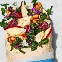 Apple Walnut Wrap · Kale medley, sliced apples, crumbled gorgonzola, candied walnuts, dried cranberries, and pom...