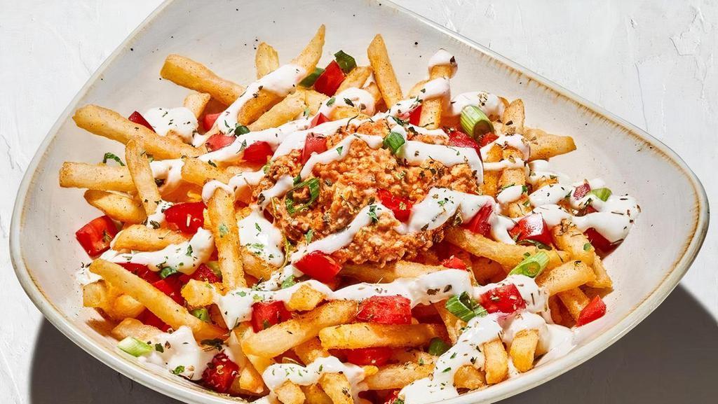 Loaded Fries · Seasoned fries, spicy feta, diced tomato, scallions, oregano, garlic feta sauce (840 Cals).