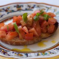 Bruschetta · Marinated Tomatoes with garlic, basil, and olive oil on country bread.