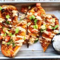 Tater Skins · Chipotle smoked gouda - Cheddar cheese- Applewood bacon- Roma tomatoes- Green onions- Chipot...