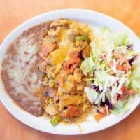 Arroz Con Pollo · Tender chicken with tomato, onion, bell pepper on top of rice smothered in ranchera sauce to...