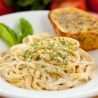 Fettuccine Alfredo Dinner · Freshly-made fettuccine pasta with alfredo sauce and choice of meat. Served with salad and g...