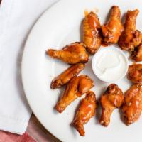 10 Wings · Oven baked wings with your choice of sauce.