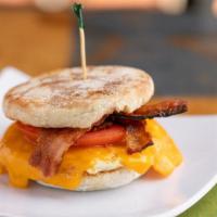 Egg Muffin* · One egg, real or mock bacon, or real ham, tomato, and mixed cheddar cheese.
