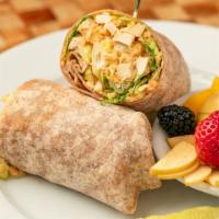 Chicken Caesar Wrap* · Grilled natural chicken breast, Spanish rice, and a caesar salad on whole wheat tortilla.
