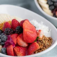 Swamis Pitaya Bowl* · Pitaya fruit blended with mango, pineapple juice, banana, served with seasonal berries, bana...