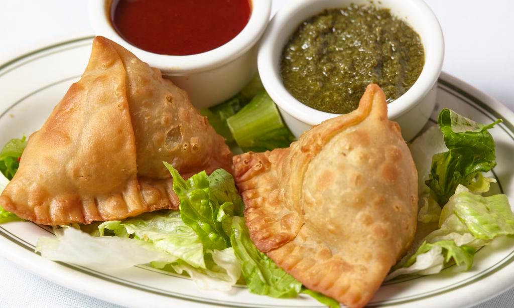 Vegetable Samosa · 2 spicy turnovers stuffed with potatoes and green peas.