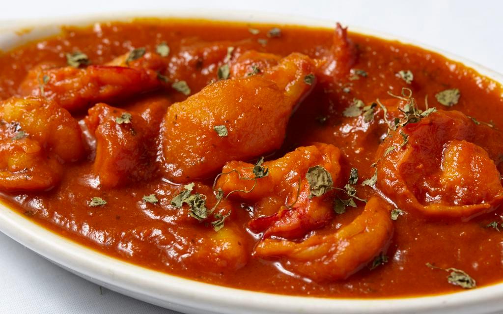 Shrimp Vindaloo · Jumbo shrimp cooked with potatoes in a hot tangy sauce.