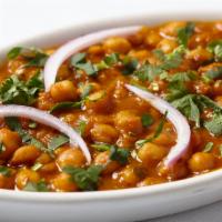 Channa Masala · Chick peas soaked overnight with potato cooked in fresh tomato onion and spices.