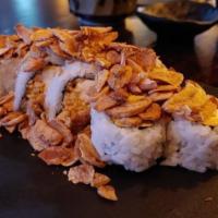 Salmon Temptation · Inside: spicy crab, shrimp tempura. Outside: salmon, avocado, fried onion, green onion, tobi...