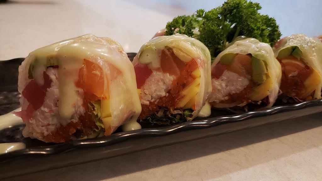 Umi Spring Roll (No Rice) · Inside: crab meat, spicy tuna, mango, avocado, asparagus, spring mix, salmon, tuna. Outside: rice paper. Sauce: wasabi mayo.