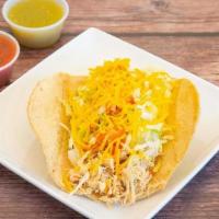 Chicken Taco A La Plancha · Served crispy with shredded chicken, lettuce, cheese and taco sauce