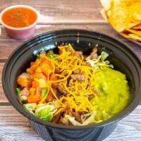 Carne Asada Bowl · Grilled angus steak, whole beans, rice, lettuce, guacamole, pico de gallo, side of chips