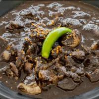 Dinuguan · Filipino savory pork stew simmered in a rich, spicy dark gravy of pig's blood, garlic, chili...
