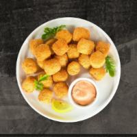 Tater Totsidoo · (Vegetarian) Shredded Idaho potatoes formed into tots, battered, and fried until golden brow...