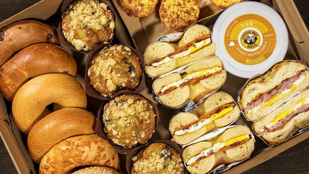 Hot & Ready Brunch Box · Brunch for the family taken care of. Box includes-6 bagels (2 Plain, 1 Sesame, 1 Asiago, 1 Chocolate Chip, and 1 Cinnamon Raisin, 1 tub of Plain Shmear, 1 Farmhouse Egg Sandwich, 2 Bacon & Cheddar Egg Sandwiches, 4 Twice Baked Hashbrowns, and 4 Blueberry Muffins.