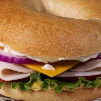 Turkey & Cheddar · Turkey, cheddar, lettuce, tomato, onions, mayo and mustard on your choice of bagel.