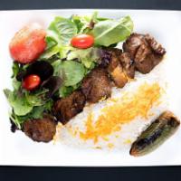 Filet Kabob (Shish) · Tender slices of filet mignon Served with hummus, white basmati rice,
grilled tomato, jalape...