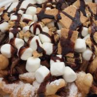 New! Smore Funnel Cake · Funnel cake tipped with Gramcracker,  marshmellow  and Hershey chocolate syrup