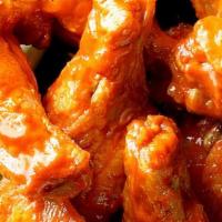 Buffalo Wings · Most popular. Tossed in buffalo sauce. Served with carrots, celery sticks, ranch dressing, a...