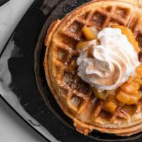 Peach Cobbler Waffle · Our made from scratch sweet vanilla bean waffle, topped with powdered slow-simmered sugared ...