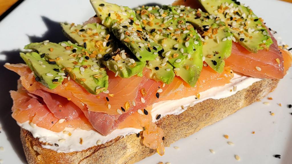 Smoked Salmon Toast · Freshly baked sourdough bread topped off with Smoked Salmon, Cream Cheese, Avocado. Topped off with Everything Bagel Seasoning. Add a second slice for $5!