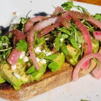 The Remix Avocado Toast · Freshly baked sourdough bread topped off with Avocado, Goat Cheese, Micro Cilantro, and Hous...