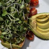 Avocado Toast · Freshly baked sourdough bread topped off with avocado slices, truffle oil and micro greens. ...