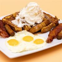 Cinnamon French Toast · 4 slices of French toast topped with whipped cream, apples, powdered sugar, and cinnamon. Co...