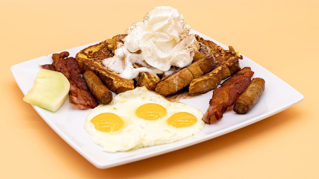 Cinnamon French Toast · 4 slices of French toast topped with whipped cream, apples, powdered sugar, and cinnamon. Comes with 3 eggs, and choice of bacon, sausage, or ham.
