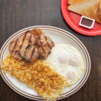 Pork Chops Breakfast · 2 pork chops, 3 eggs, choice of a breakfast side, and a bread side.