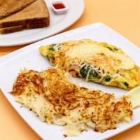 Salmon Omelette · Smoked salmon, spinach, grilled onions, tomatoes, Hollandaise sauce, eggs, and melted mozzar...