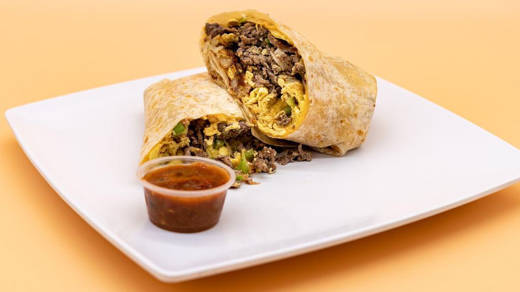 Machaca Breakfast Burrito · Shredded beef, grilled onions, bell peppers, tomatoes, eggs, fresh hashbrowns, and melted shredded cheese in a flour tortilla.