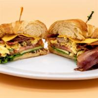 Croissant Breakfast Sandwich · Croissant, (choice of bacon, sausage, or ham), eggs, melted American cheese, lettuce, tomato...