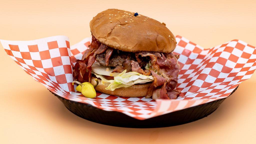 Pastrami Burger · Bun, hamburger patty, juicy pastrami, onions, lettuce, tomato, pickles, and our signature 1000 Island dressing.