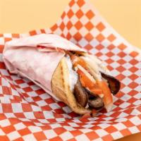 Gyro Sandwich · Gyro meat, red onions, tomatoes, and tzatziki sauce wrapped in pita bread.