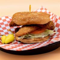 Fish Sandwich · Sesame seed bun, deep-fried fish, lettuce, tomato, and tartar sauce.
