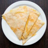 Cheese Quesadilla · A flour tortilla filled with melted shredded cheese.