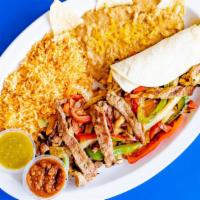 Fajitas · (Choice of chicken, steak, or shrimp), grilled onions, bell peppers, and tomatoes. Comes wit...
