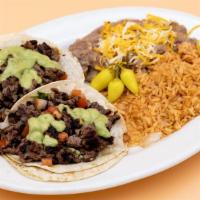 Taco Plate · 2 tacos. Comes with refried beans and Mexican rice.