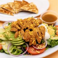 Crispy Chicken Salad · Chicken strips, lettuce, tomato, cucumbers, onions, shredded cheddar cheese, and a hardboile...
