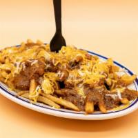 Chili-Cheese Fries · An order of French fries covered in our fresh chili and melted shredded cheese.