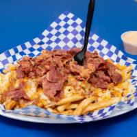 Pastrami Chili-Cheese Fries · French fries covered in juicy pastrami, fresh chili, and melted shredded cheese.