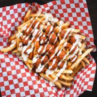 Buffalo Fries · French fries covered with popcorn chicken, spicy buffalo sauce, and creamy ranch dressing.